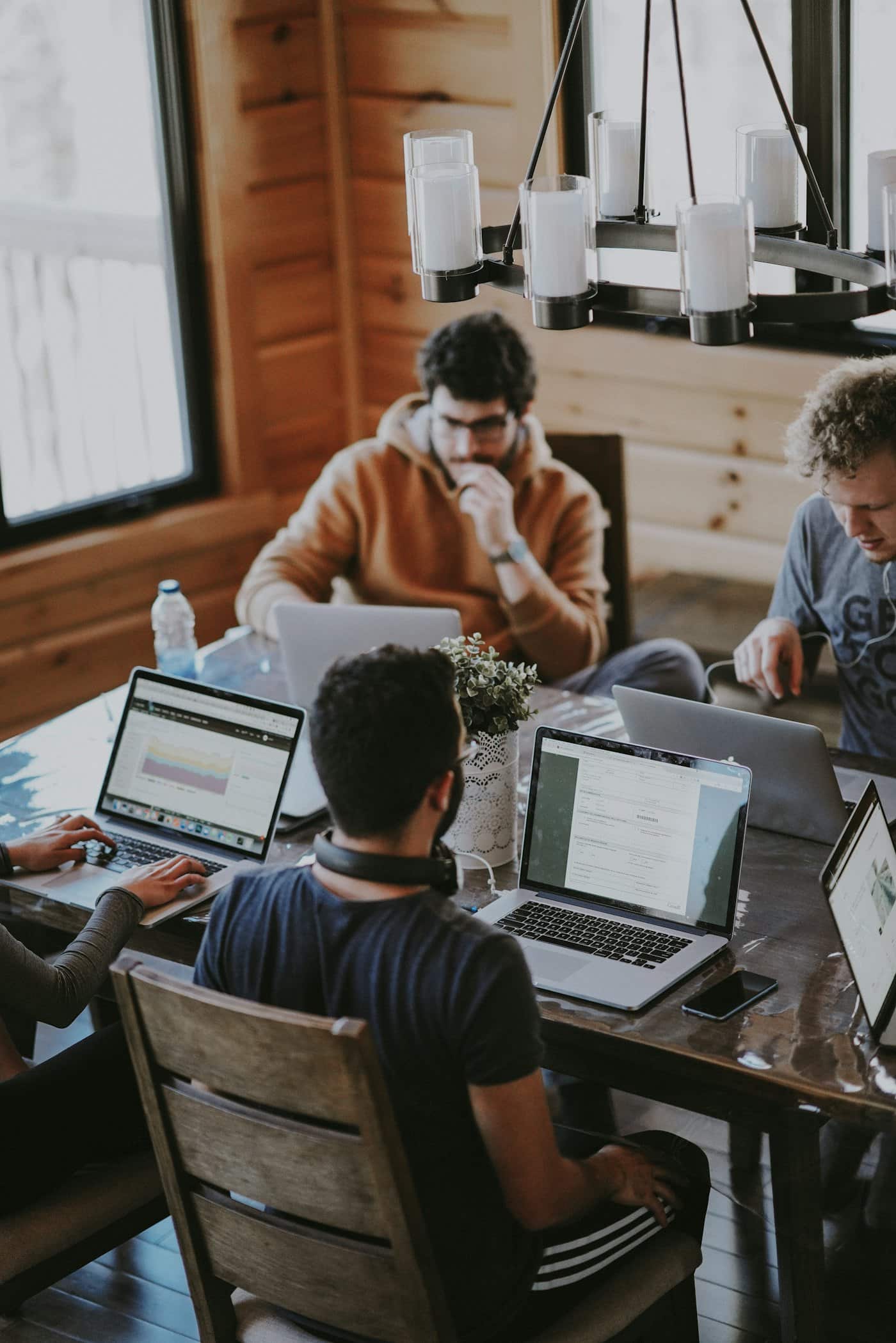 Professionals reviewing documents around a conference table