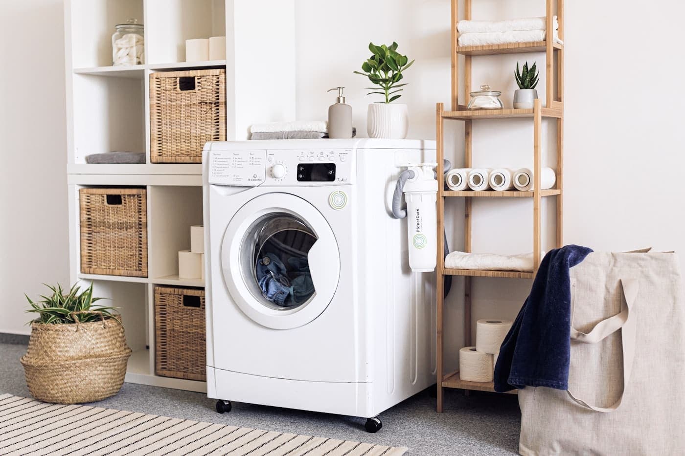 Row of front-load washing machines in a clean laundromat