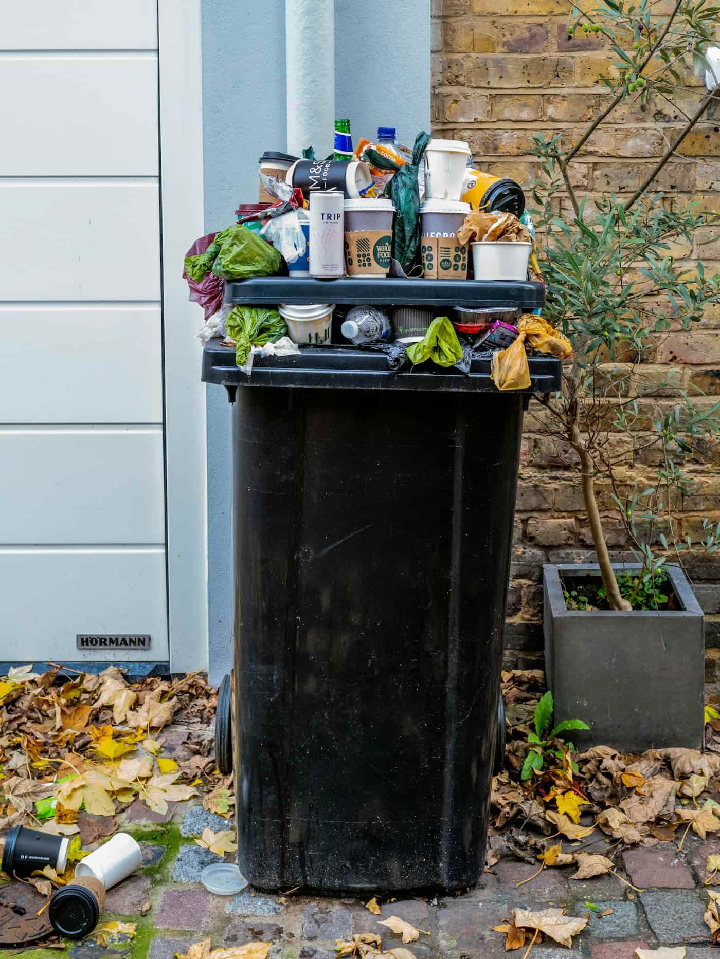 Pickup truck loaded with materials parked in front of a home